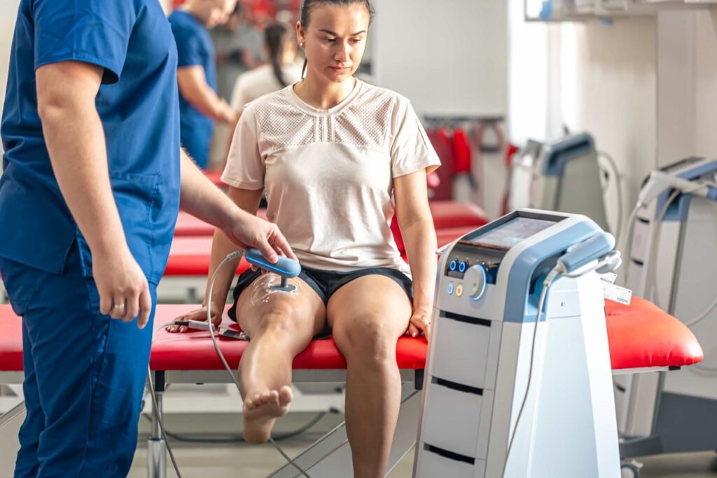 doctor-using-machine-treat-knee-joints-patient (1)