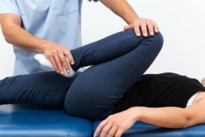 physiotherapist-doing-exercises-with-female-patient (1)