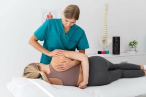 physiotherapist-helping-patient-her-clinic (1)